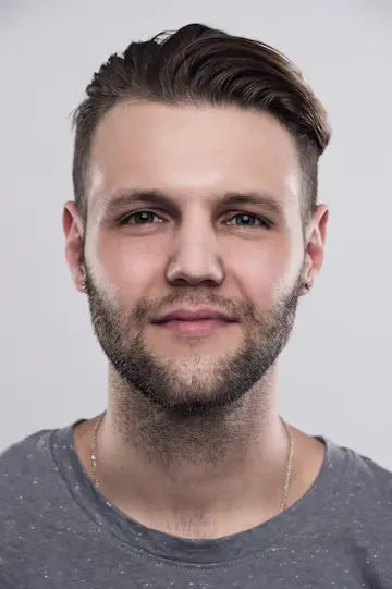 files/close-up-portrait-serious-gloomy-bearded-man-with-stylish-hairstyle-posing_160360-855.webp